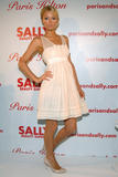 Paris Hilton poses at the unveiling of her new hair extension line at 620 Loft and Garden in New York City