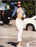 Adriana Lima posing in skimpy outfits and topless (covered) in Elle magazine -  